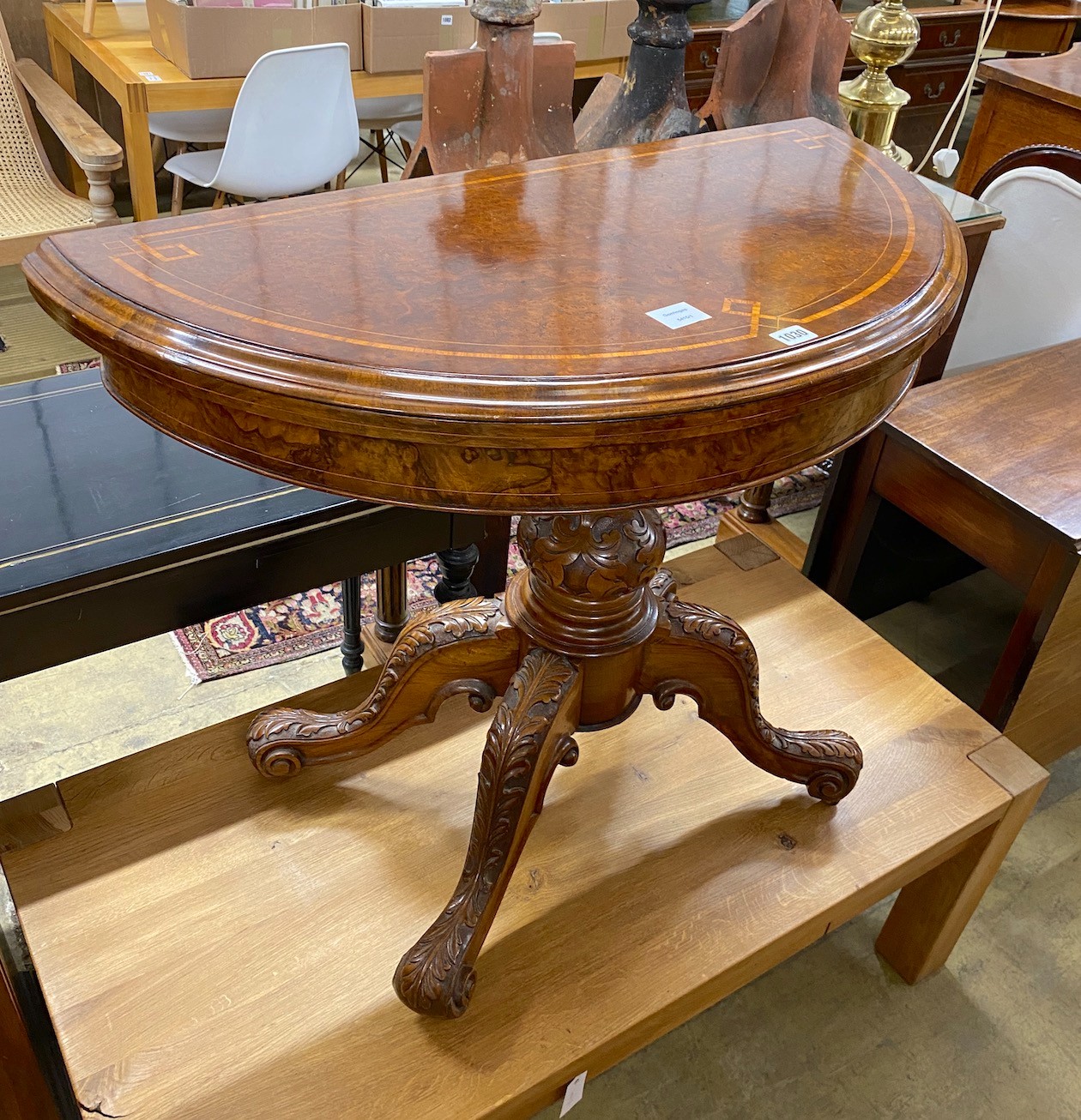 A mid Victorian tulip banded burr walnut 'D' shaped folding card table width 92cm, depth 45 cm, height 71cm